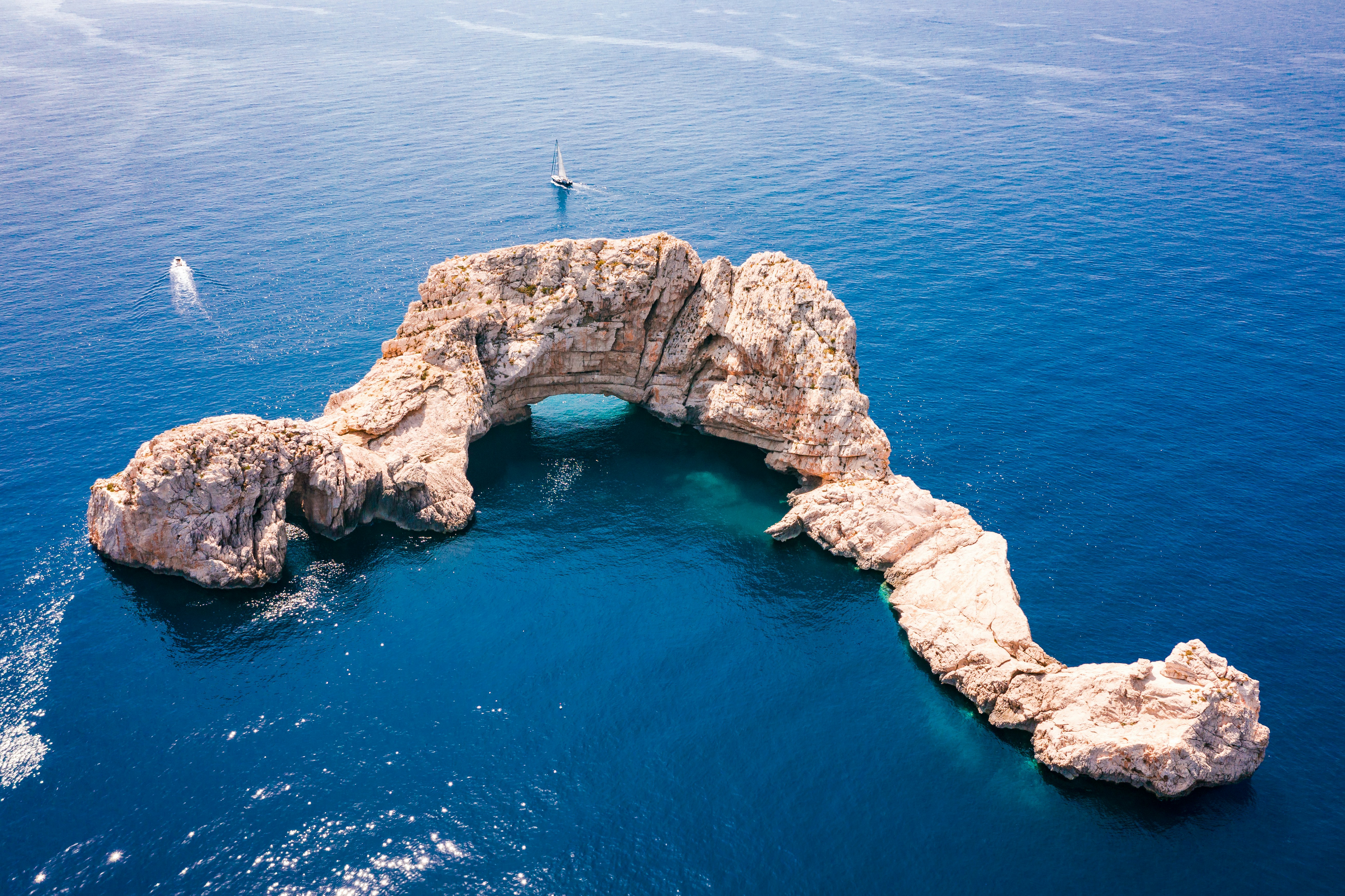 Aerial view of Es Vedra with deep blue water